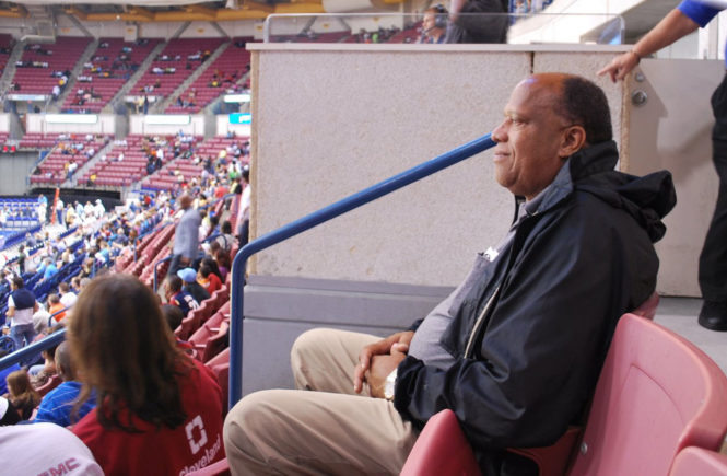 Daddy watching NBA players warm up.