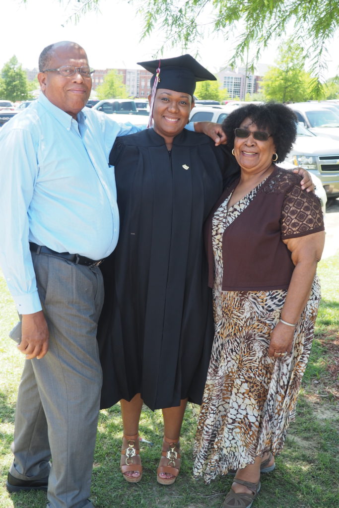 My dad, me and my mom at my graduation in Starkville.
